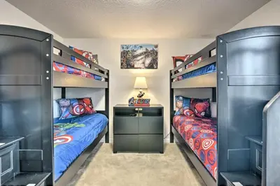two beds in a room with two twin beds at Look over Nature, Pool Home Near Disney Parks in Kissimmee
