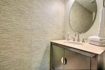 a bathroom with a sink and a mirror at Look over Nature, Pool Home Near Disney Parks in Kissimmee