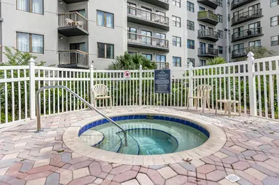 a hot tub in a patio in front of a building at 22 -The heart of International Dr - Universal in Orlando