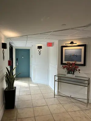 a hallway with a exit sign on the wall at 29-Universal, International Dr,Convention Center in Orlando