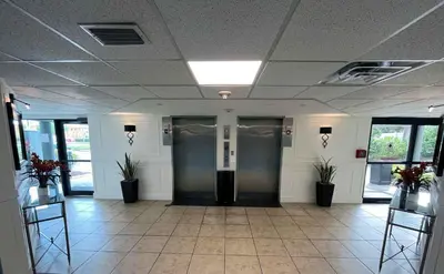 a hallway with two elevators in a building at 29-Universal, International Dr,Convention Center in Orlando
