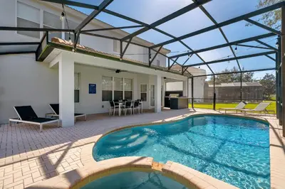 a swimming pool with a glass roof over a house at 6Q Windsor Hills, Piscina Privativa + Game Room in Orlando