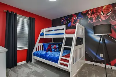a bedroom with two bunk beds and a marvel mural at Casa 7Q perto da Disney com Piscina e Games in Kissimmee
