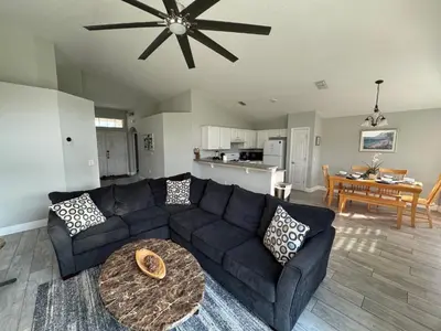 a living room with a couch and a table at Casablanca Villa in Kissimmee
