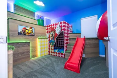 a room with a play room with a slide at Brand New 12-bedroom Amazing house 5869 in Orlando