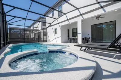 a swimming pool in the middle of a house at Brand New 12-bedroom Amazing house 5869 in Orlando