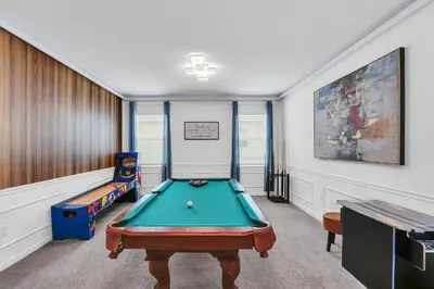 a game room with a pool table and a game table at Spacious Dreamscape 12rooms 11 bathrooms 25 people Wifi in Kissimmee
