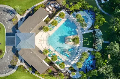 an overhead view of a swimming pool with palm trees at Spacious Dreamscape 12rooms 11 bathrooms 25 people Wifi in Kissimmee