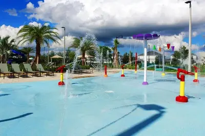 a pool with a water park with a water slide at Villa 5 Quartos com Piscina no Storey Lake in Kissimmee