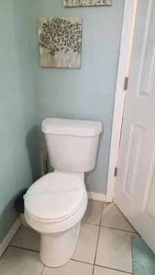 a bathroom with a white toilet in a room at Disney Area Condo at Laguna Bay Villas! in Kissimmee