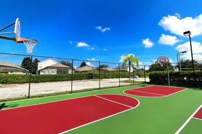 a basketball court with a basketball hoop at Windsor Palms Oasis Harry Potter Mickey Pool Spa in Kissimmee