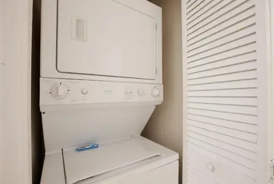 a white washer and dryer in a small kitchen at New in the market apt with big terrace! in Orlando