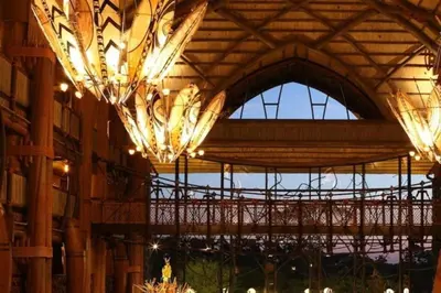 a building with chandeliers hanging from the ceiling at Disney's Animal Kingdom Villas - Jambo House in Orlando