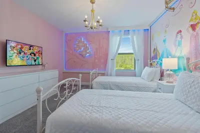 a bedroom with two beds and a disney princess mural at Brand New Home 9 Bedrooms5 Baths At Storey Lake in Kissimmee