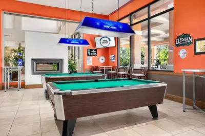 a billiard room with two pool tables at Sweet 3 bedroom Townhome 2407 in Orlando