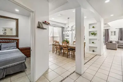 a room with a bed and a dining room at 765 Beautiful Vacation Home With Private Pool, And Much More!! in Kissimmee