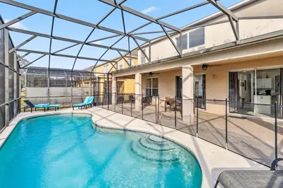 an indoor swimming pool with a glass roof at 765 Beautiful Vacation Home With Private Pool, And Much More!! in Kissimmee
