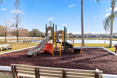 a playground with a slide in a park at 765 Beautiful Vacation Home With Private Pool, And Much More!! in Kissimmee