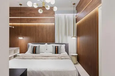 a bedroom with a large bed with a wooden headboard at 5911 Luxury 10BD Family Home For an Unforgettable Vacation in Orlando
