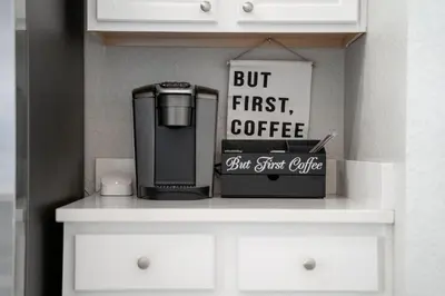 a coffee maker and a box on a shelf at Disney THEMED HOME, PRIVATE HEATED POOL, COMMUNITY WATERPARK in Orlando