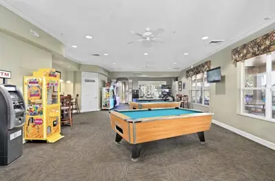 a billiard room with a pool table in a store at Beautiful 3 bed townhome in Windsor Hills Resort in Orlando