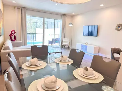 a living room with a table and chairs at TR1459SL - Brand new Star Wars property with pool in Orlando
