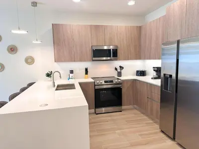 a kitchen with a sink and a refrigerator at TR1459SL - Brand new Star Wars property with pool in Orlando
