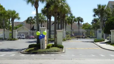 a parking lot with a bunch of balloons on a pole at Resort Condo with all amenities needed-Cane Island in Kissimmee