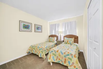a bedroom with two beds and a window at Townhome Perfectly Located Near Clubhouse in Kissimmee