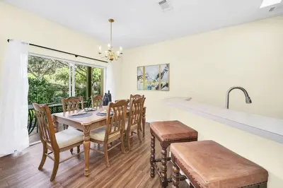 a kitchen and dining room with a table and chairs at Townhome Perfectly Located Near Clubhouse in Kissimmee