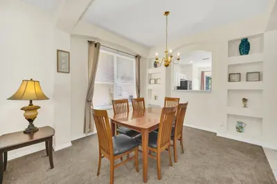 a dining room with a table and chairs at Emerald Island Resort 6 bedroom 4 bathroom luxury in Kissimmee