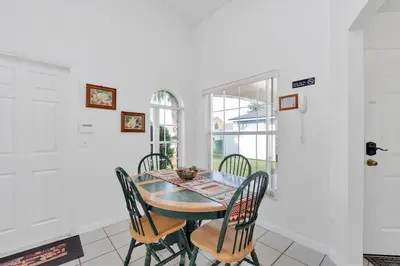 a dining room with a table and chairs at Cute Vacation Home Very Close to Disney in Orlando