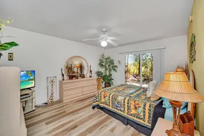 a bedroom with a bed and a window at Beautiful Royal Palm Bay Condo near Disney in Kissimmee