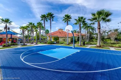 a basketball court at a resort with palm trees at Wonderful Terra Verde Orlando Vacation Home in Kissimmee