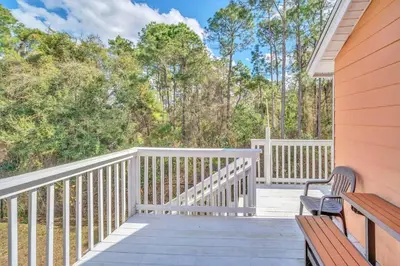 a porch with two benches on a house at Incredible Island Club Villa Condo in Kissimmee