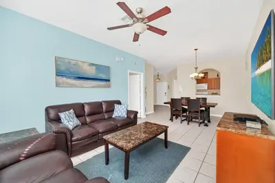a living room with a couch and a table at 3 Bedrooms Condo Only Minutes From Disney in Orlando