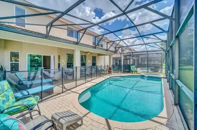 a large swimming pool with a glass roof at Windsor Hills Dream Private Screened Pool Home in Orlando