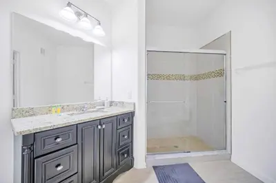 a bathroom with a shower and a sink at Cozy 3BR Apartment - Vista Cay Resort near Disney! in Orlando