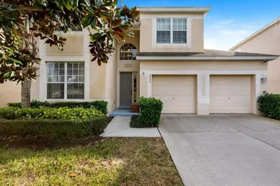 a house with a driveway and a garage at Olivia's Dream Villa on WindsorHills in Orlando