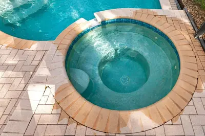 a swimming pool with a wooden circle around it at Olivia's Dream Villa on WindsorHills in Orlando