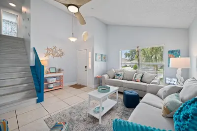 a living room with a couch and a table at Chatham House in Kissimmee