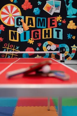 a ping pong table with a ping pong ball at Chatham House in Kissimmee