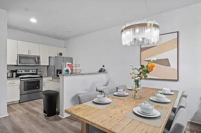 a kitchen and dining room with a table and chairs at Modern 3 Bed Villa Newly Renovated Prime Location in Kissimmee