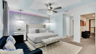a bedroom with a bed and a couch at Magic Moments in Kissimmee