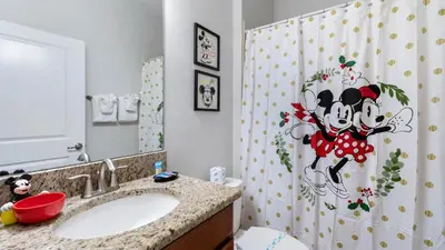 a bathroom with a sink and a shower curtain at Magic Moments in Kissimmee