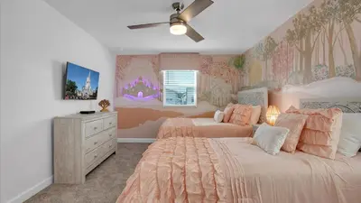 a bedroom with two beds and a dresser at Sierra Sky in Kissimmee