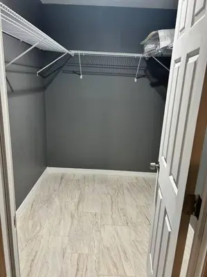 an empty room with a closet with a wooden floor at Tranquile Vacation Home near Universal studio in Orlando