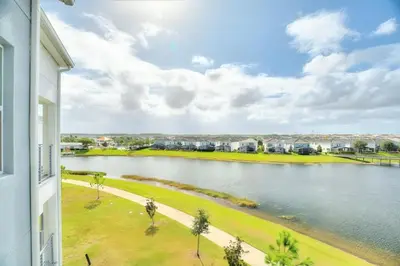 a view of a river from a building at Storey Lake Resort 2bd Condo Overlooking Water #840 condo in Kissimmee