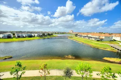 an aerial view of a river with houses and condos at Storey Lake Resort 2bd Condo Overlooking Water #840 condo in Kissimmee