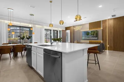 an open kitchen and dining room with a large island at Brand NEW 9Bedrooms9Bathrooms At Paradiso Grande in Orlando